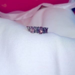 I have a trio of amethysts in this silver ring with marquisate stones